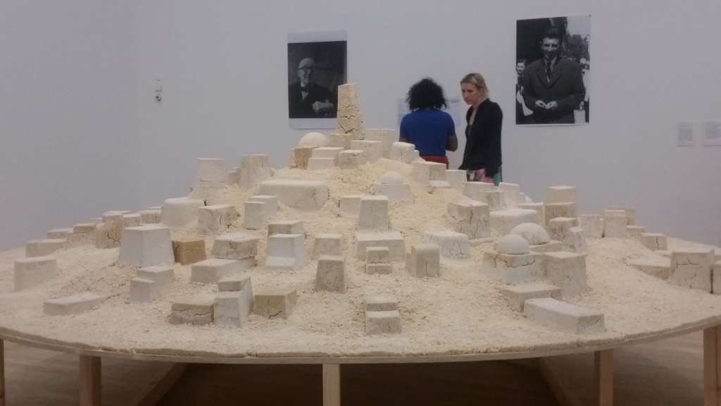 Kader Attia, Untitled (Ghardaia), 2009 Cooked couscous on wooden table and digital prints on paper (c) SK